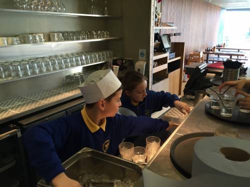 Utku and Lucy keep the kitchen clean.