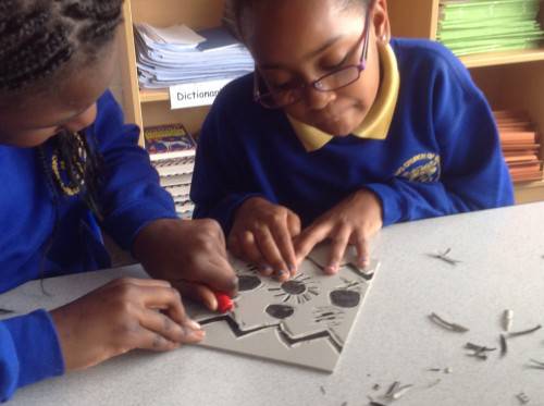 Next we used a carving tool to carve our designs out of the Lino. This was very tricky and required lots of concentration