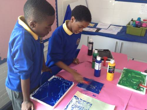 We then chose a fabric as a background and used a roller to add a chosen colour for our prints.